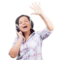 Fototapeta premium Happy Smiling Beautiful Young Woman Listening Music with Headphones and Singing