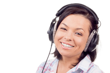 Happy Smiling Beautiful Young Woman Listening Music with Headphones