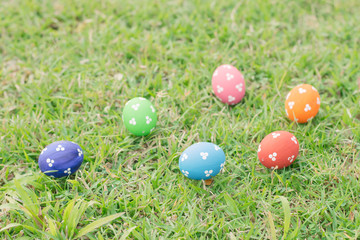 Colorful easter eggs on green grass