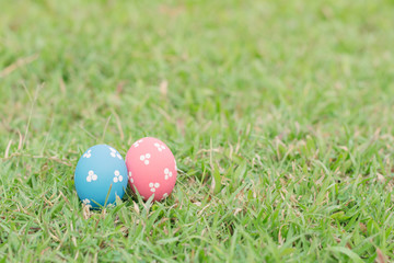 Colorful easter eggs on green grass