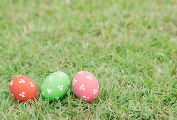 Colorful easter eggs on green grass