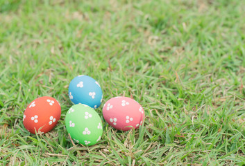 Colorful easter eggs on green grass