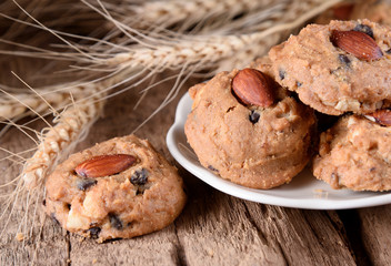 homemade almond cookies on wooden background.
