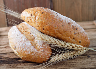 bread and wheat on the wooden