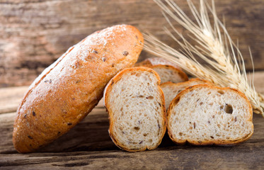 bread and wheat on the wooden