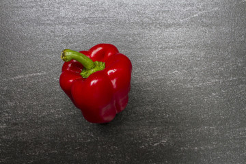 Red sweet pepper. Sweet Pepper are rich sources of antioxidants and vitamin C.Top view with copy space. Dark background.