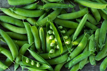 pods young green juicy peas, top view