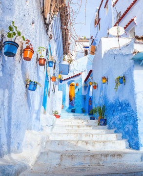 Colorful  narrow old street in medina at sunny morning , Chefchaouen, Morocco.