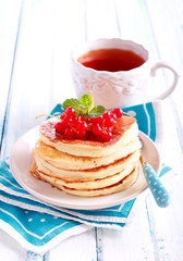 Stack of pancakes with berries on top