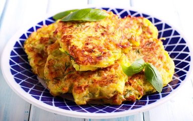 Courgette and dill fritters on plate