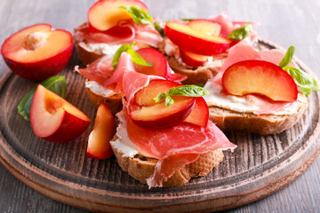 Plum, prosciutto and ricotta bruschetta