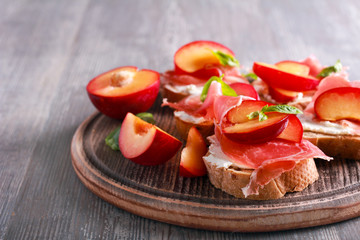 Plum, prosciutto and ricotta bruschetta