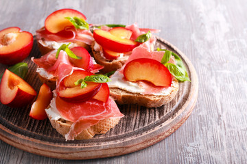 Plum, prosciutto and ricotta bruschetta