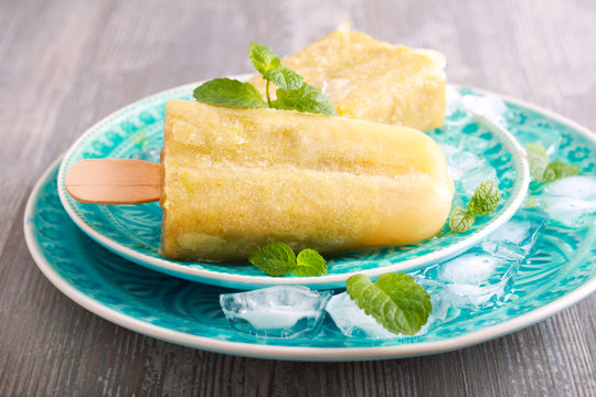 Green Popsicles On Blue Plate