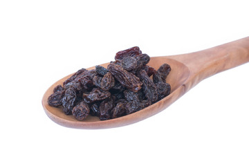 Raisins (Sultanas) in spoon wood isolated on white