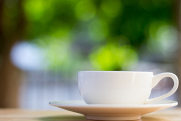 Coffee cup on bokeh background