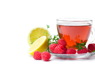 Fototapeta na wymiar Red fruit tea with lemon and raspberry isolated on white background