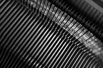 Different small metal elements of an old typewriter