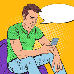 Pop Art Young Man is Reading Text Message on Smartphone. Mobile Technologies. Vector illustration