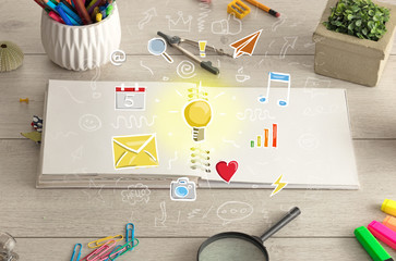 Open notebook on the floor with instruments nearby