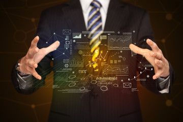 Businessman holding business plan graphics