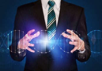 Businessman holding DNA