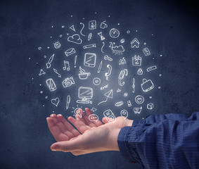 Hand holding mixed drawings