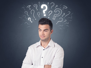 Businessman with question marks