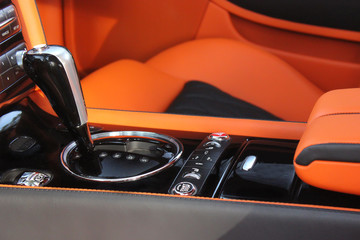 luxury car Interior - steering wheel, shift lever and dashboard