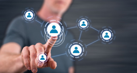Fototapeta premium Man touching a social media network on a touch screen