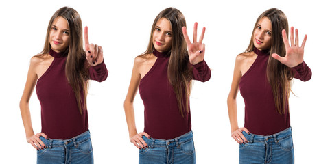 Young teenager girl counting three