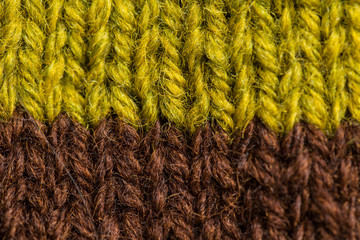 A beautiful closeup of a hand knitted warm and soft wool pattern. Soft socks or scarf of natural wool. Colorful pattern.