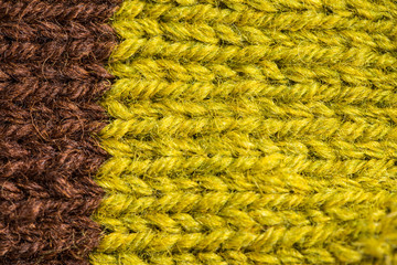 A beautiful closeup of a hand knitted warm and soft wool pattern. Soft socks or scarf of natural wool. Colorful pattern.
