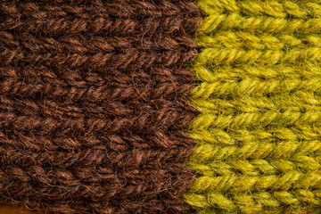 A beautiful closeup of a hand knitted warm and soft wool pattern. Soft socks or scarf of natural wool. Colorful pattern.
