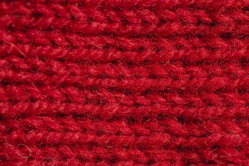 A beautiful closeup of a hand knitted warm and soft wool pattern. Soft socks or scarf of natural wool. Colorful pattern.