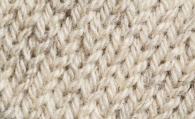 A beautiful closeup of a hand knitted warm and soft wool pattern. Soft socks or scarf of natural wool. Colorful pattern.