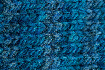 A beautiful closeup of a hand knitted warm and soft wool pattern. Soft socks or scarf of natural wool. Colorful pattern.