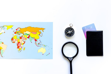 Planning trip. World map, bank card and compass on white background top view copyspace