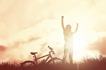Winning girl with bicycle silhouette