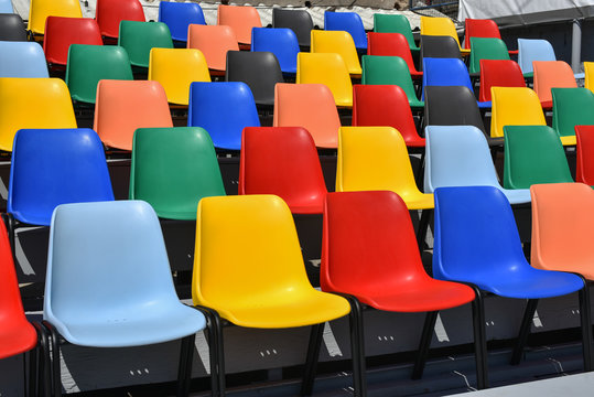 colorful plastic chairs  in rows   shoot 
