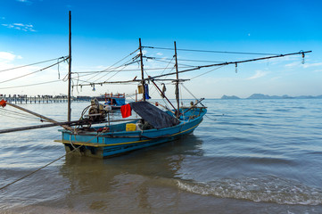 Naklejka na ściany i meble fishing boat in the sea in Thailand, south of Thailand