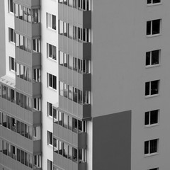Wall, window, balcony of a house in black and white