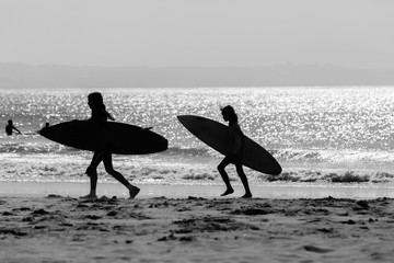 Girls Surfboards Beach Silhouetted Ocean