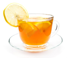 Isolated transparent cup of tea with lemon slice