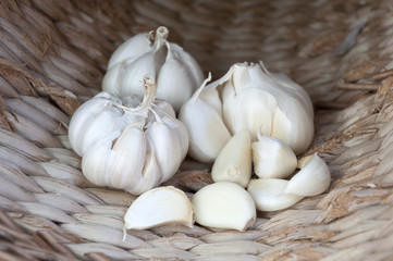 fresh white garlic in a wicker basket