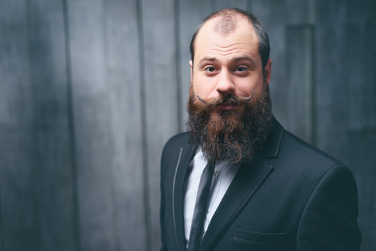 Gentleman Fashion And Style. Handsome Young Bearded Man At Suit And Tie.