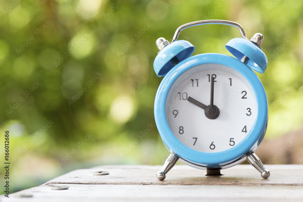 Wall mural alarm clock on the wood table