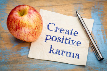 create positive karma - text on napkin