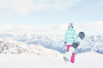 Young woman with snowboard