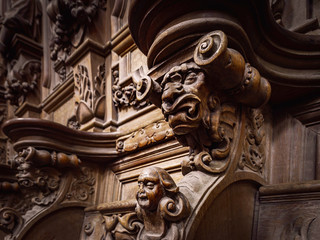 Genial wooden engraved silhouettes and faces in old Abbey Floreffe